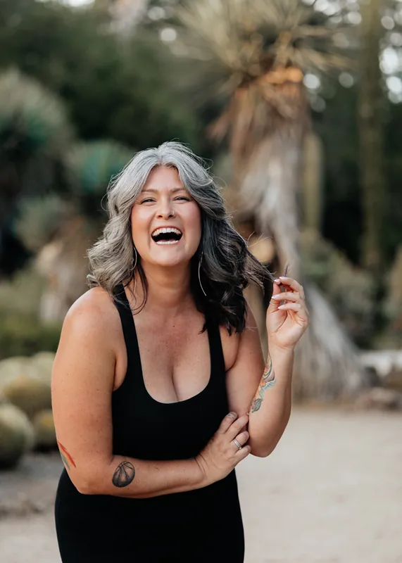 Brianne laughing outdoors