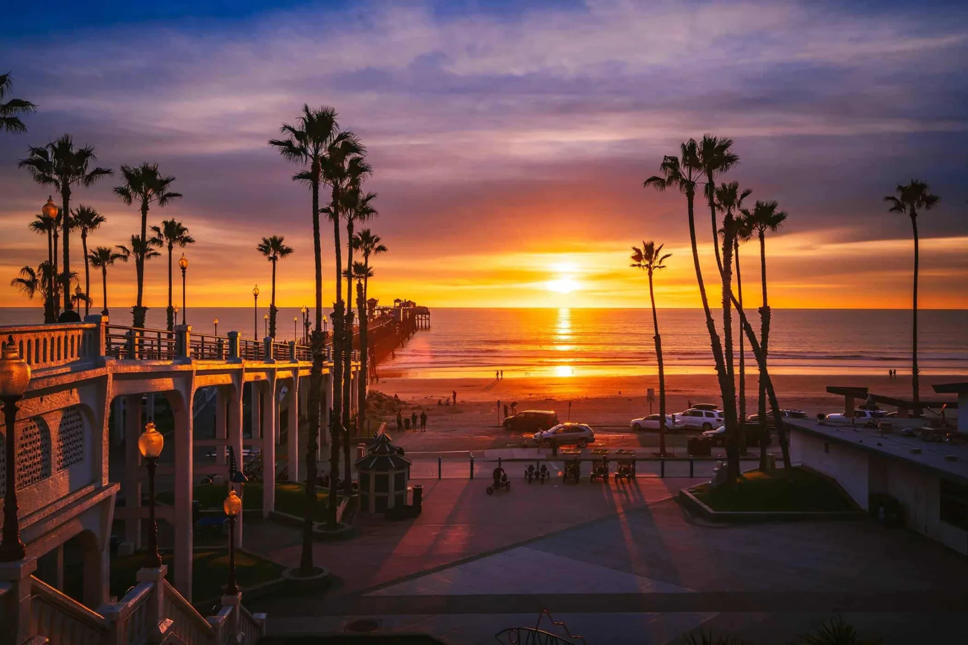 Oceanside pier stretching into the ocean at sunset
